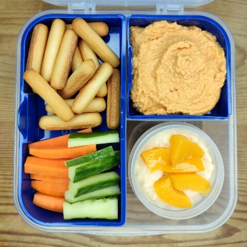 Bread sticks, hummus, veggies and rice pudding