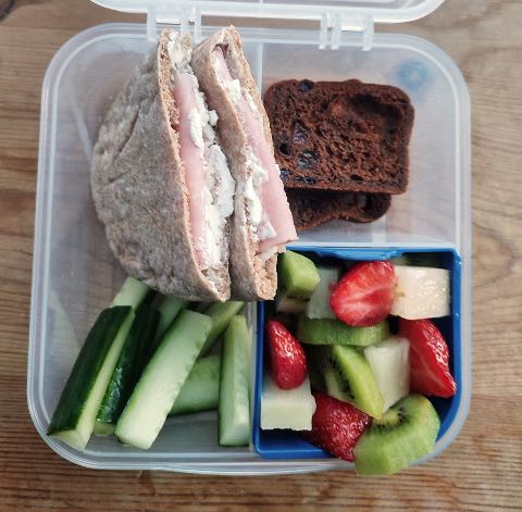 Ham pitta with fruit salad and malt loaf