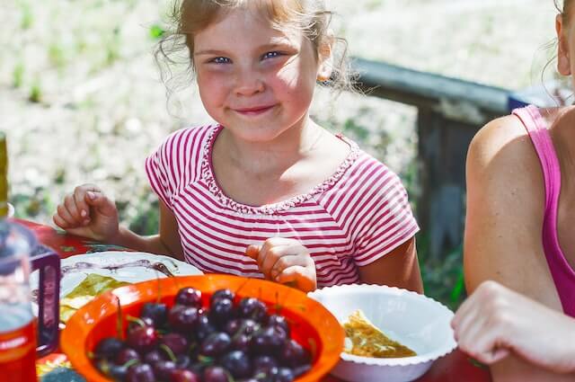 A child enjoying her meal