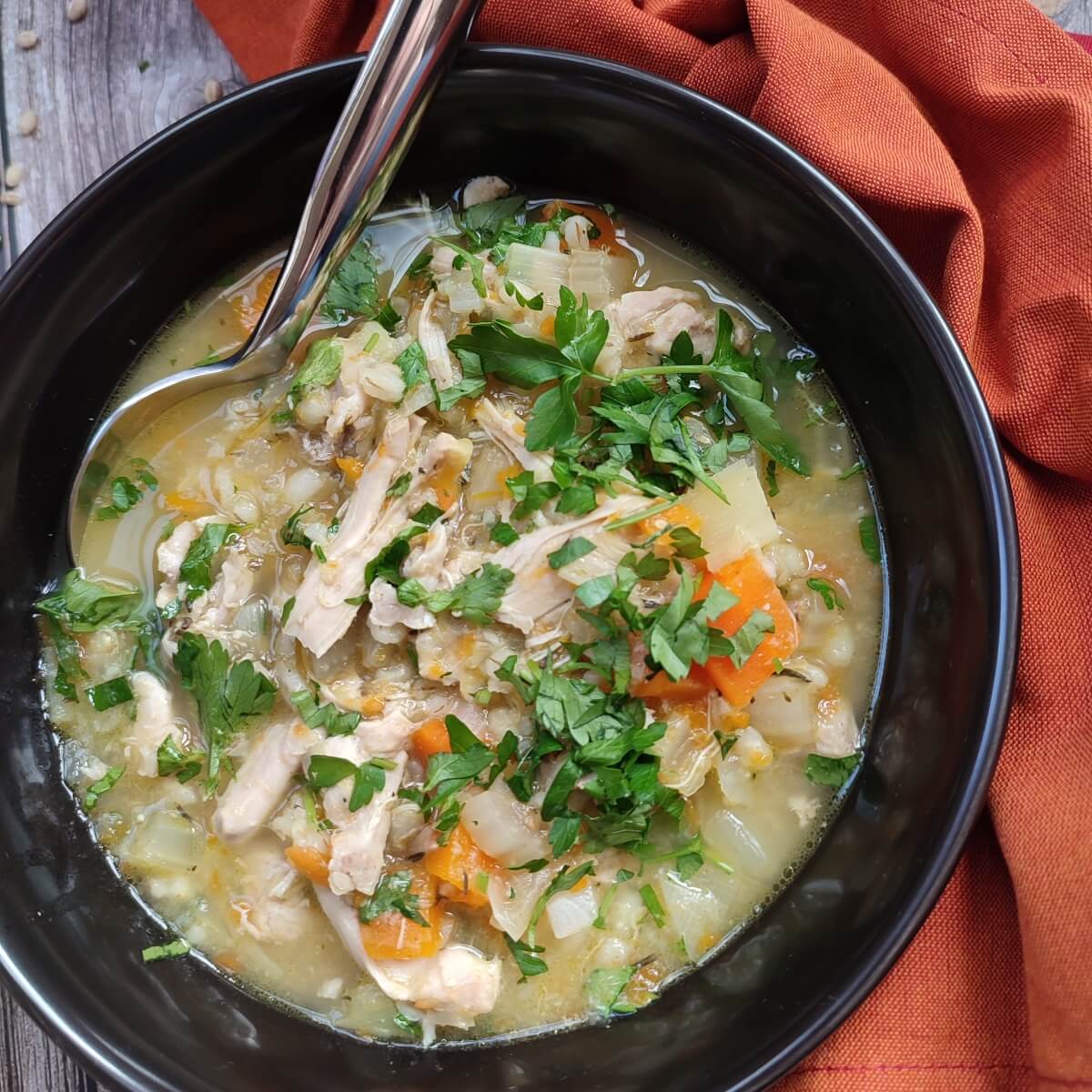 Slow cooker chicken and barley soup in a bowl